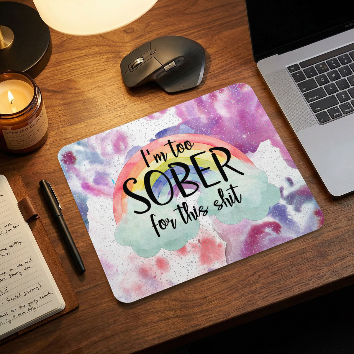 A watercolor mousepad featuring a rainbow, clouds, and the text I'm too sober for this shit.