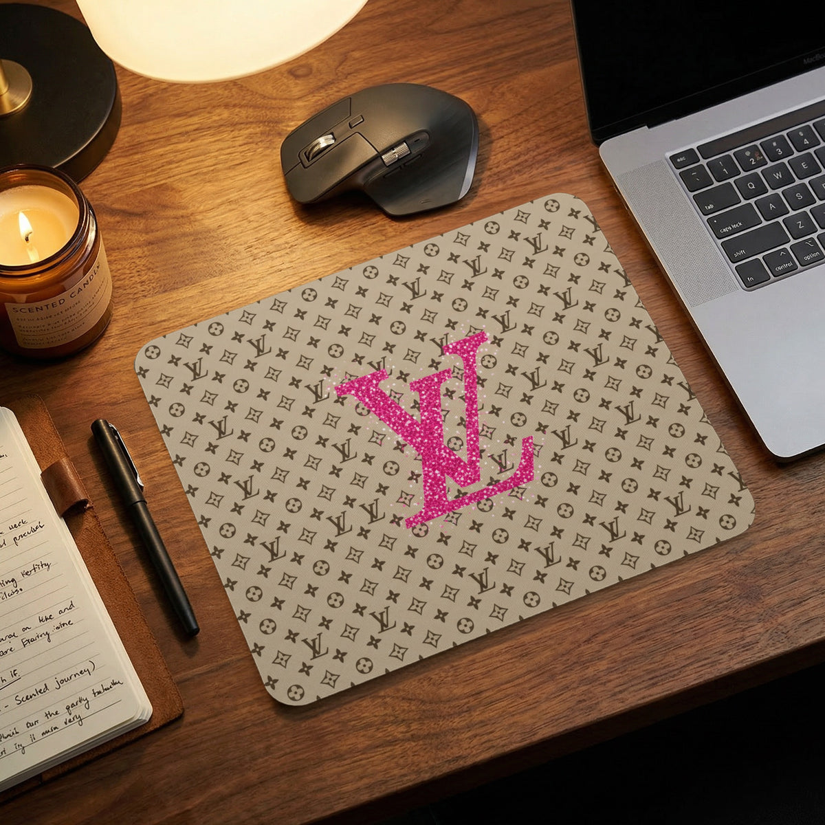 Mousepad with brown monogram pattern and large pink glitter "LV" logo.