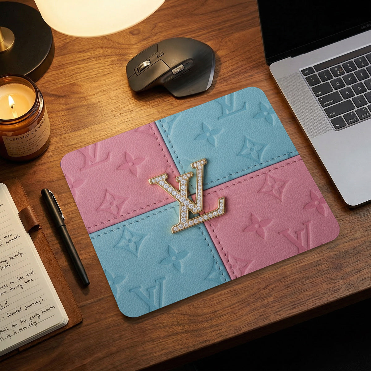 Pink and blue leather mousepad with embossed pattern and gold LV logo.