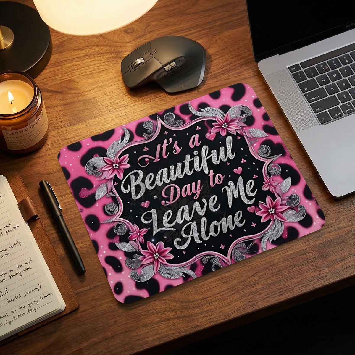 Mouse pad with a pink and black leopard print and the phrase "It's a Beautiful Day to Leave Me Alone."
