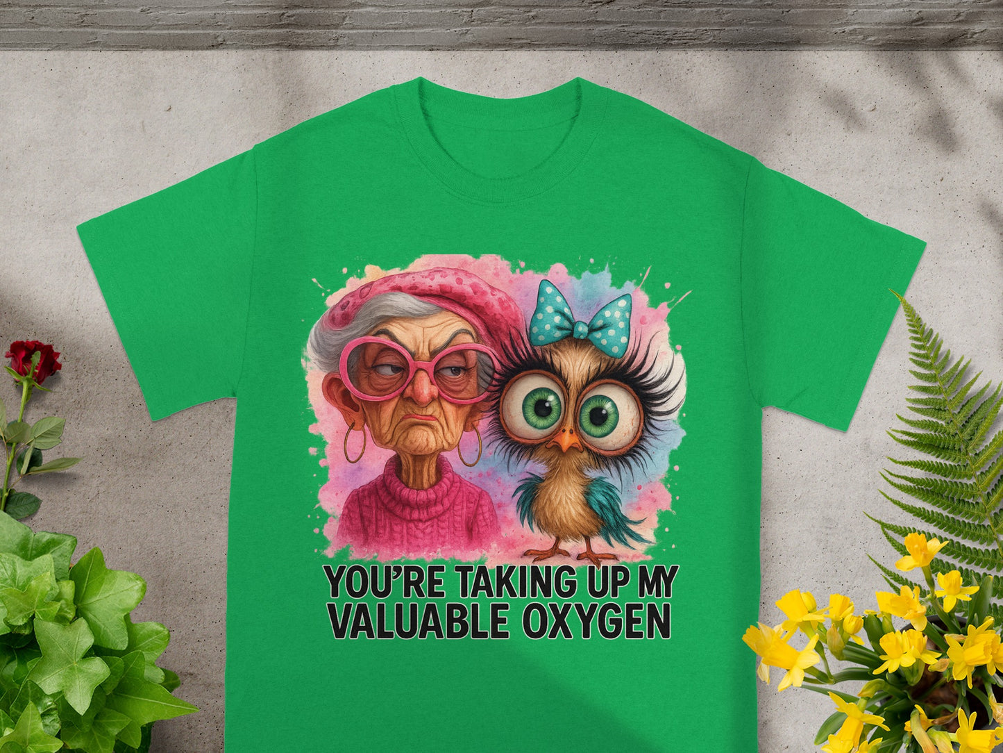 Green t-shirt with cartoon owl and grumpy woman saying "YOU'RE TAKING UP MY VALUABLE OXYGEN".