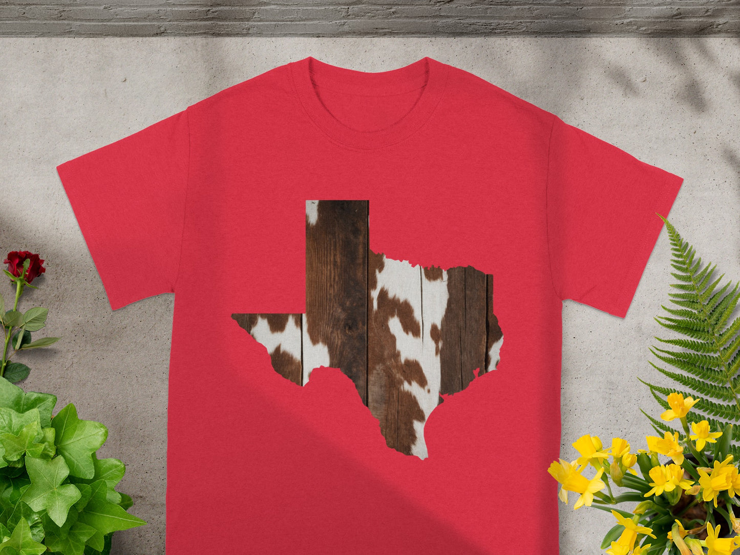 Red t-shirt with Texas shape filled with wood and cowhide pattern.