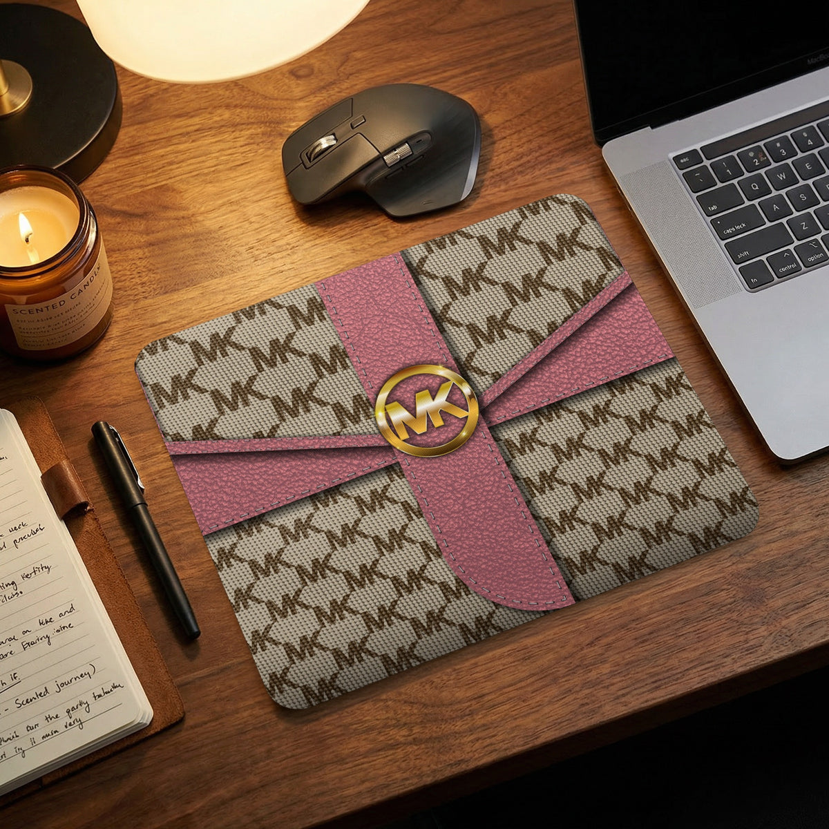 Michael Kors MK logo pattern mousepad with pink ribbon detail.