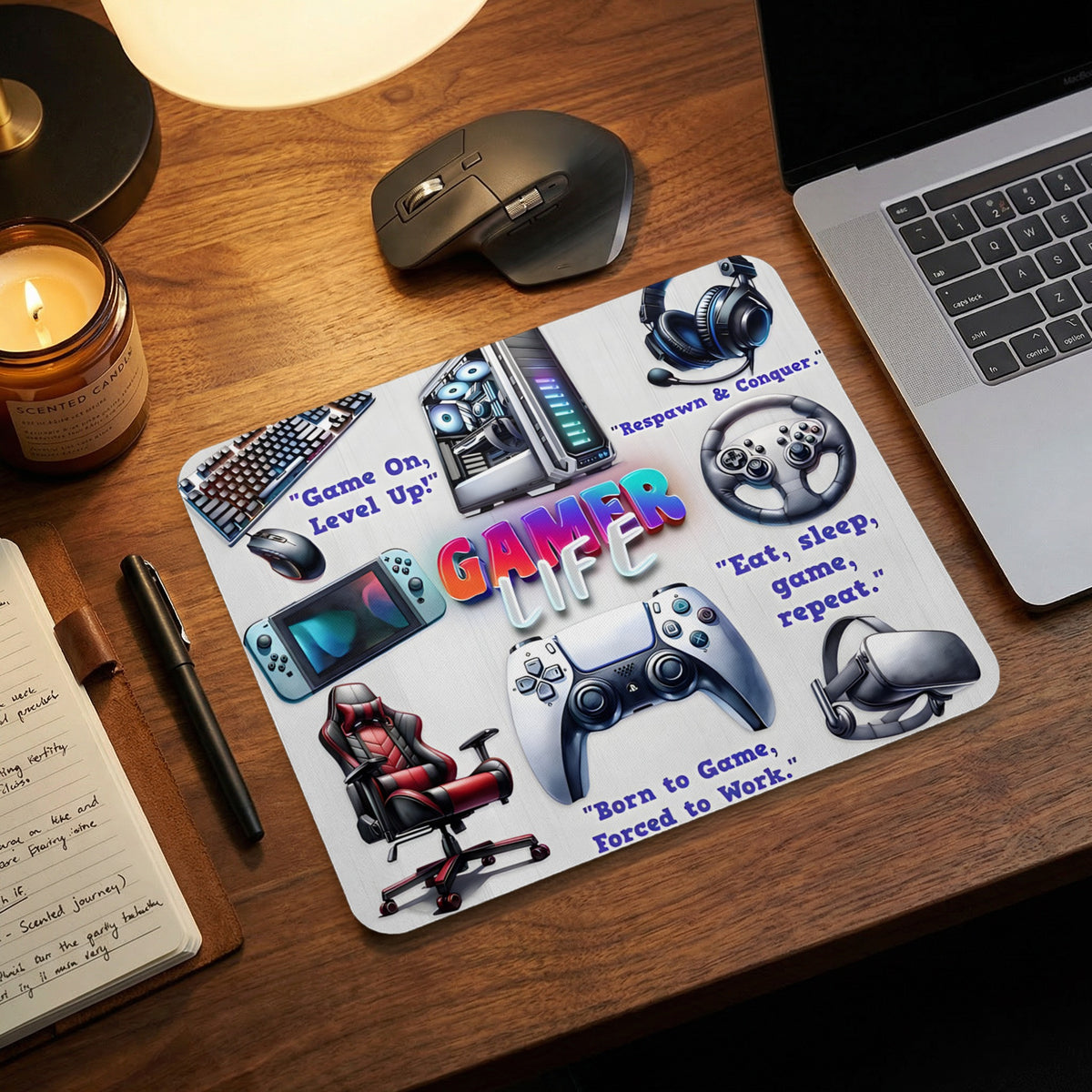 A rectangular gaming mouse pad featuring various gaming accessories, the text Gamer Life, and motivational gaming quotes on a wooden desk.