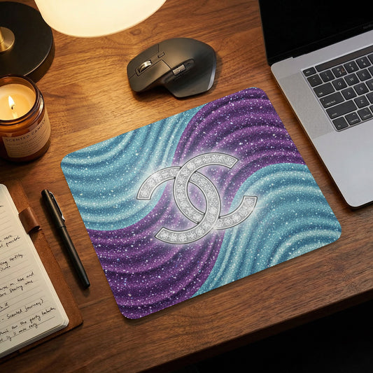 Mousepad with sparkling purple and blue waves and a diamond logo.