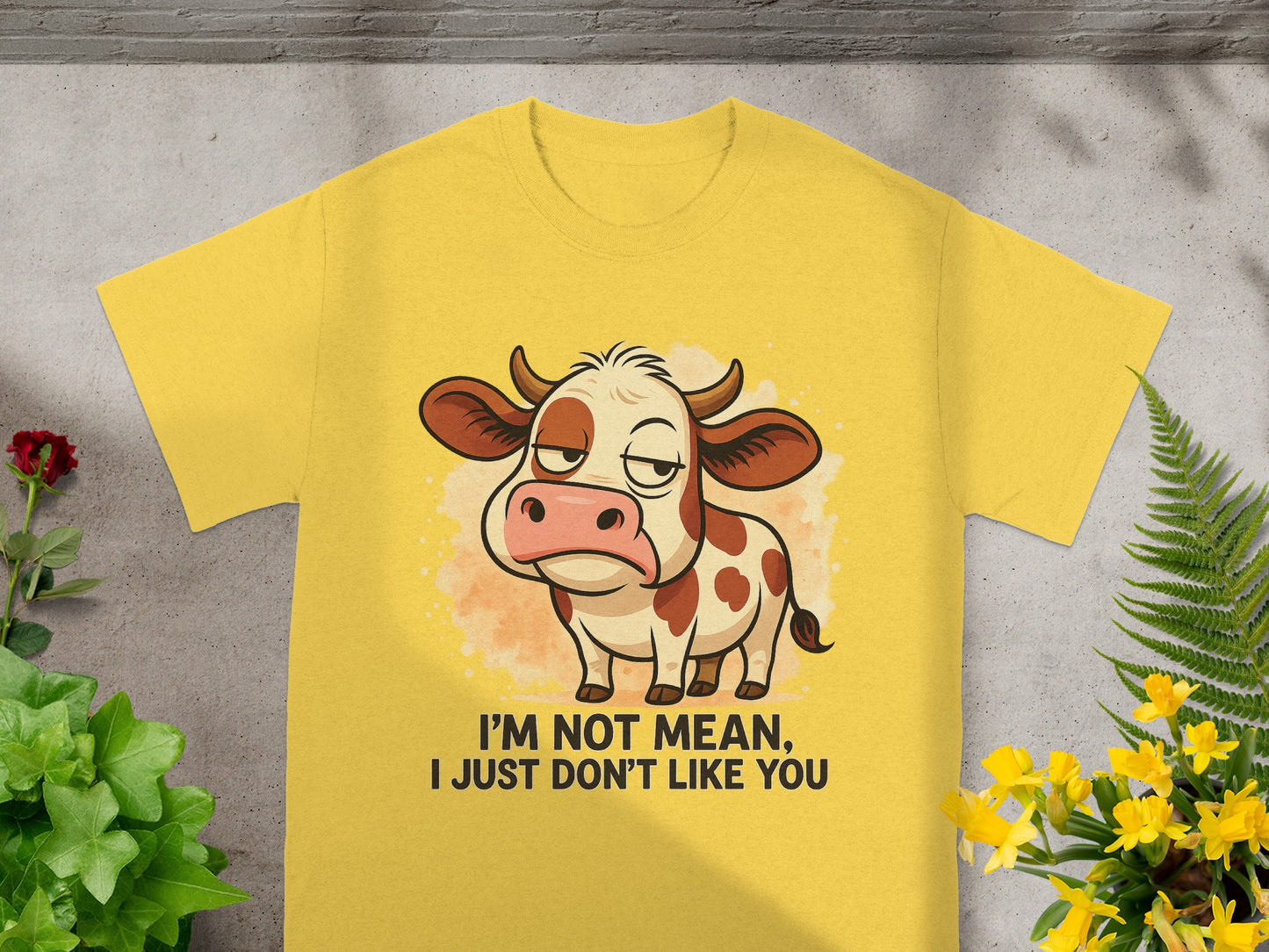Yellow t-shirt with cartoon cow and text "I'm not mean, I just don't like you".