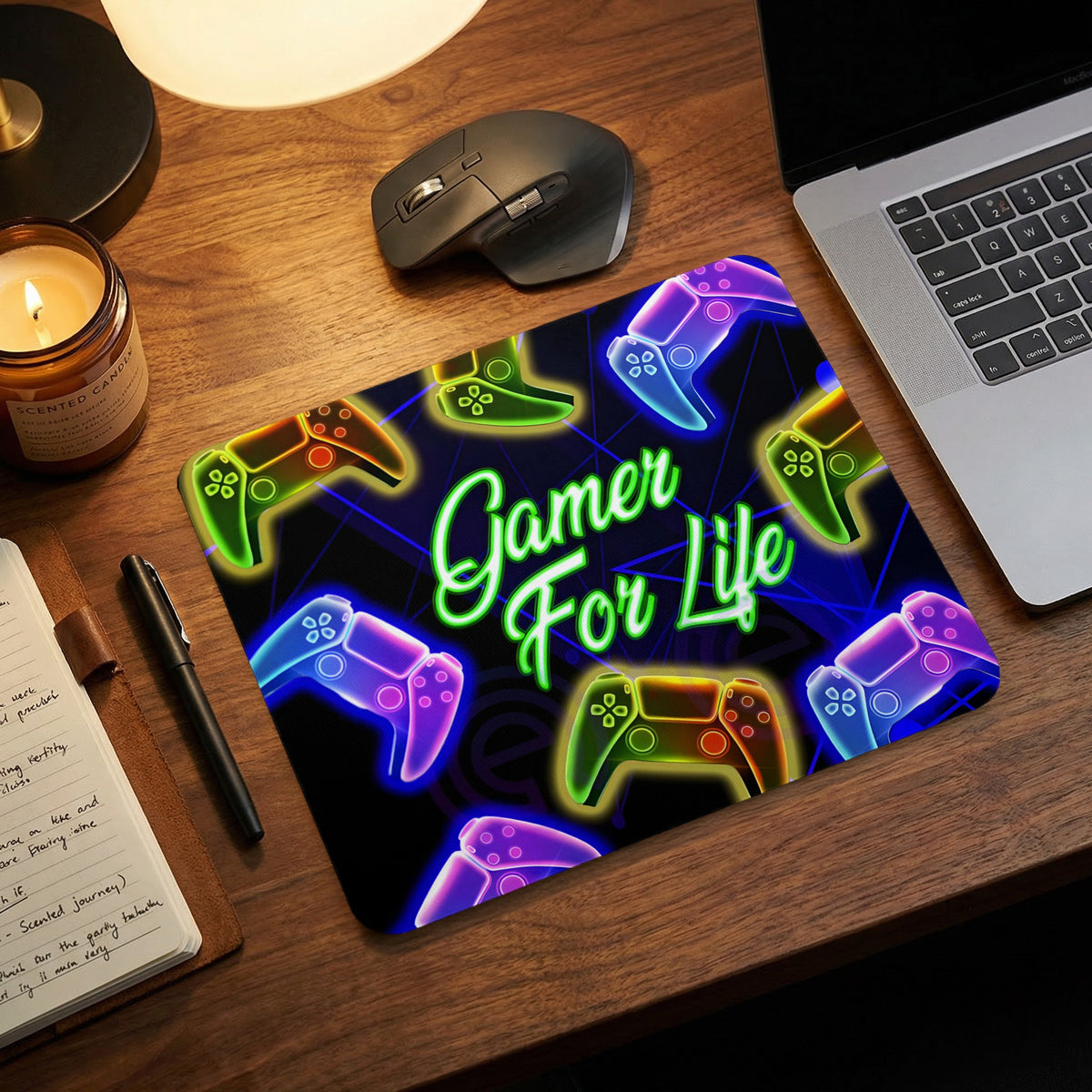Gaming mouse pad featuring colorful neon video game controllers and the text Gamer For Life.