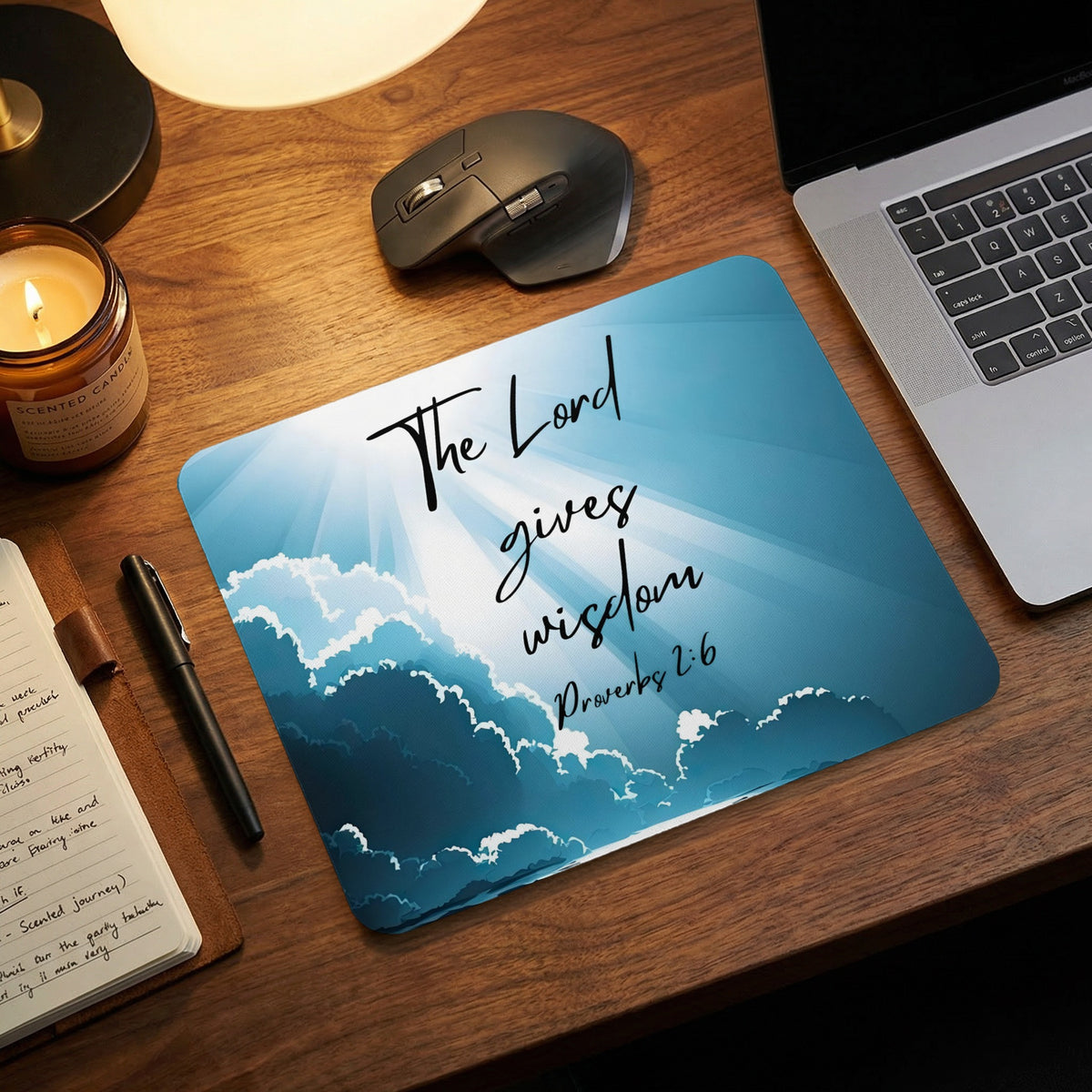 A blue rectangular mouse pad featuring a cloudy sky graphic and the text Proverbs 2:6.