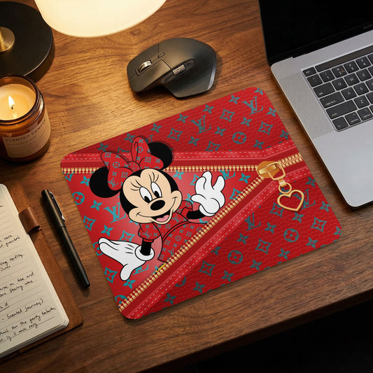 Minnie Mouse on a red mousepad with a Louis Vuitton-inspired pattern and gold zipper.