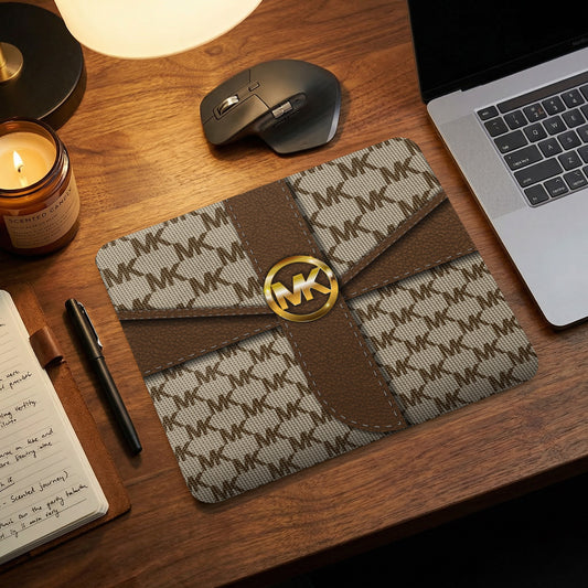 Mousepad with repeating MK pattern and a gold MK logo in the center.