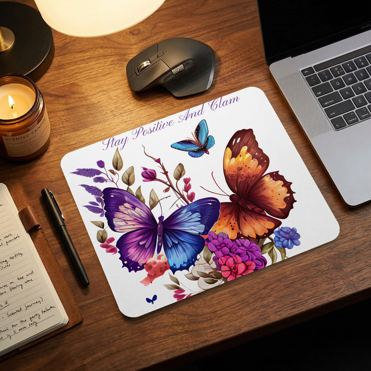 Mousepad with purple and orange butterflies and text "Stay Positive And Glam".