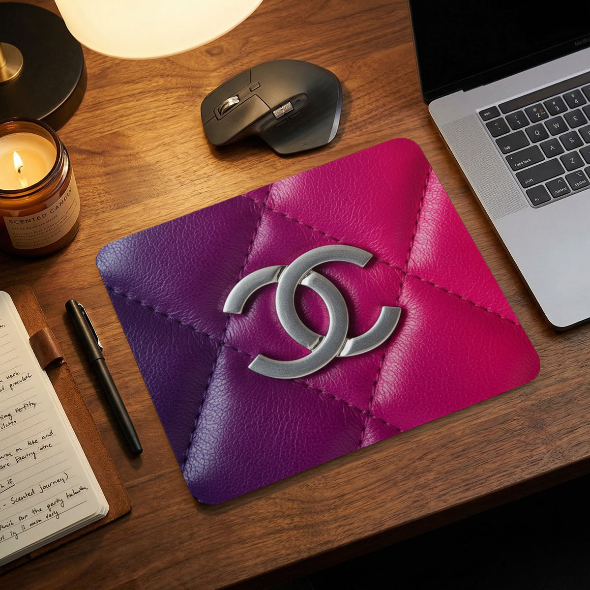 Quilted mousepad with purple-to-pink gradient and silver CC logo.