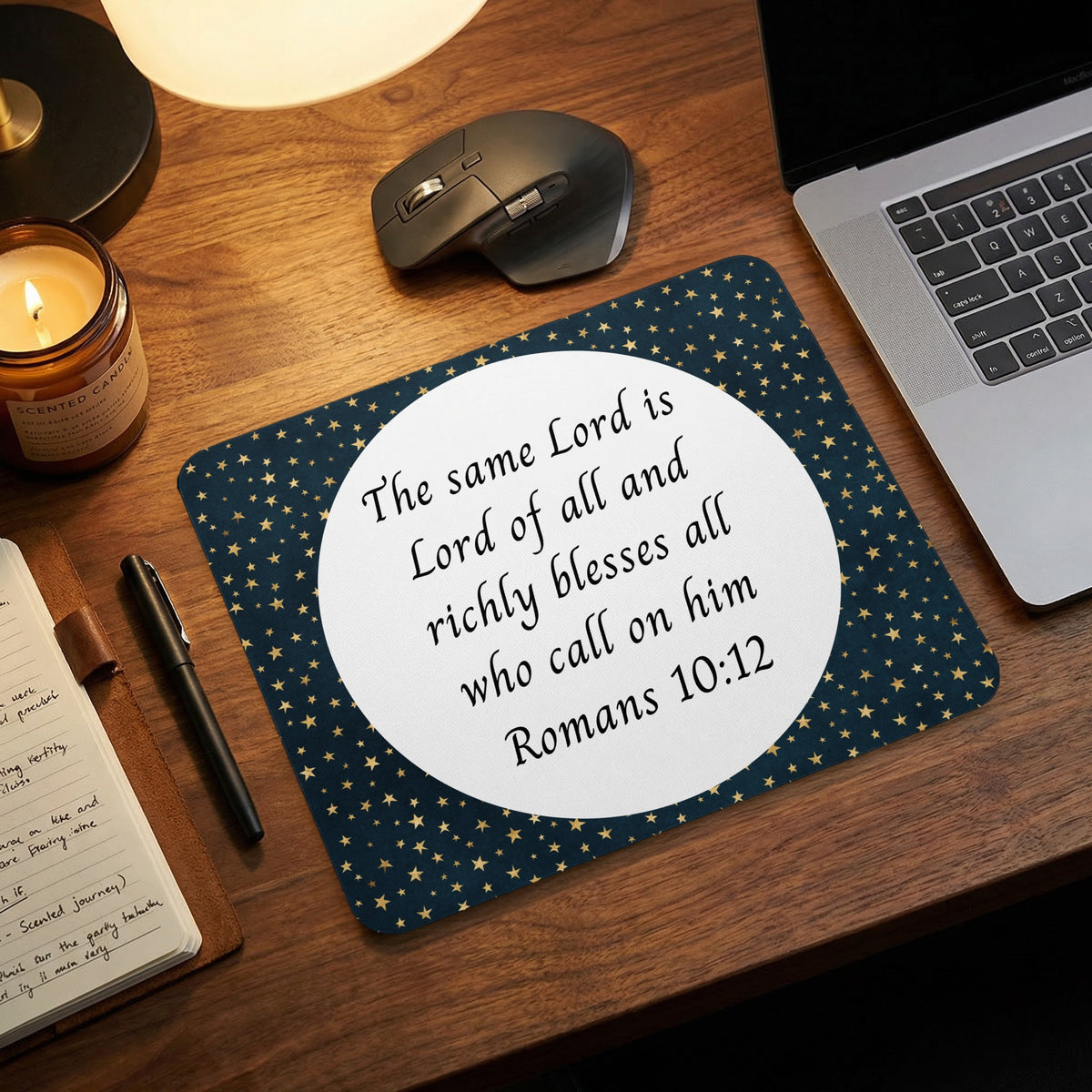 A rectangular mousepad featuring a blue star pattern and a white circle with Romans 10:12 text.