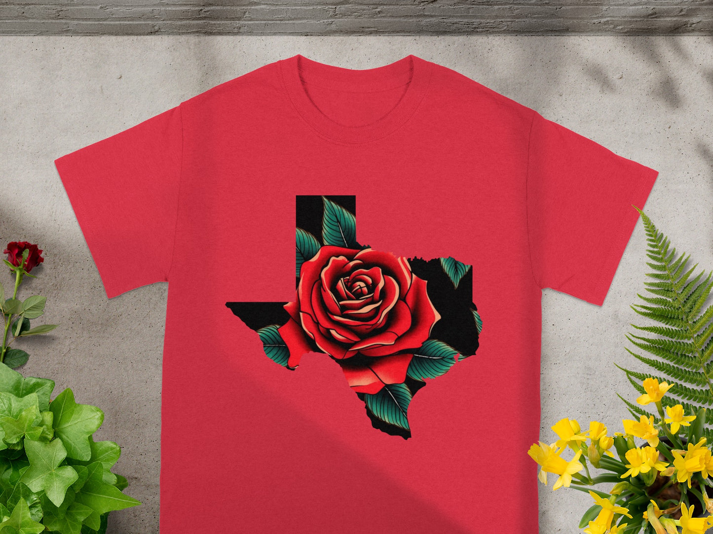 Red t-shirt with black Texas outline filled with a red rose and green leaves.