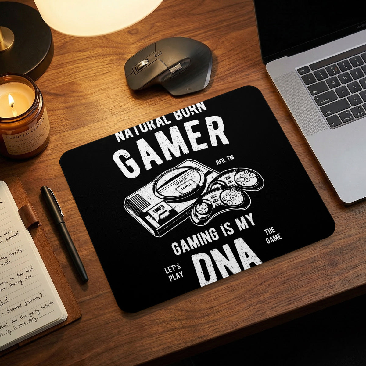 Black mouse pad with white text reading Natural Born Gamer, Gaming is My DNA, featuring a retro console graphic.