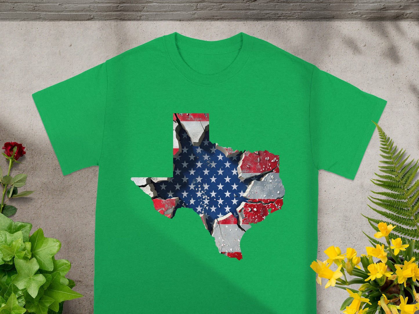 Green t-shirt with cracked Texas outline displaying American flag pattern.