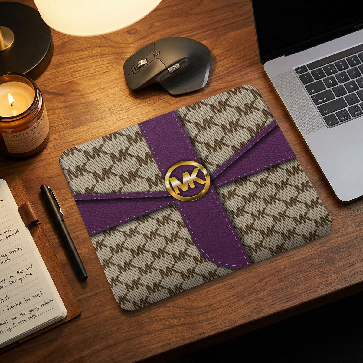 Michael Kors monogram mousepad with purple ribbon and gold logo.