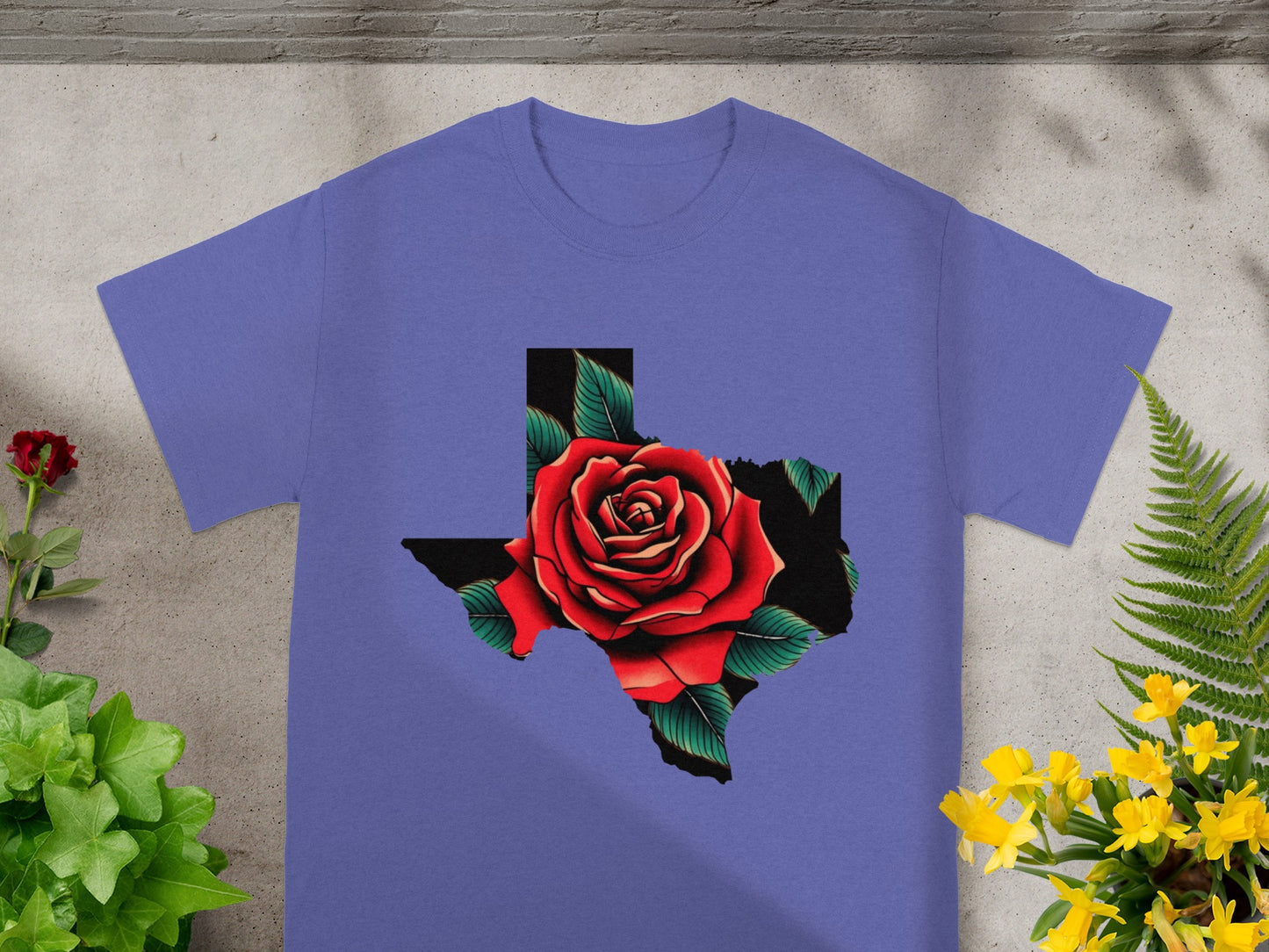 Purple t-shirt with a red rose over a black Texas shape graphic.