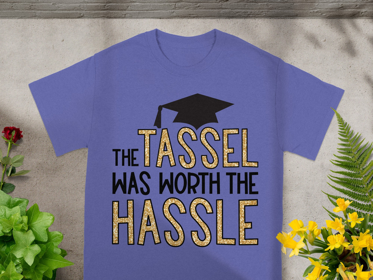 Purple t-shirt with "The Tassel Was Worth The Hassle" text and graduation cap.