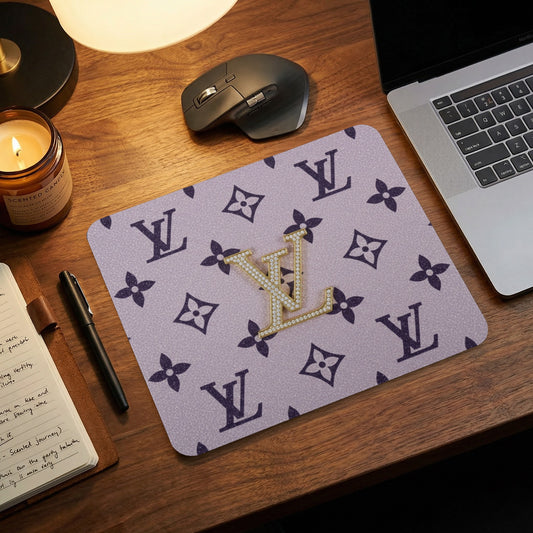 Mousepad with dark purple LV pattern and gold diamond LV logo.