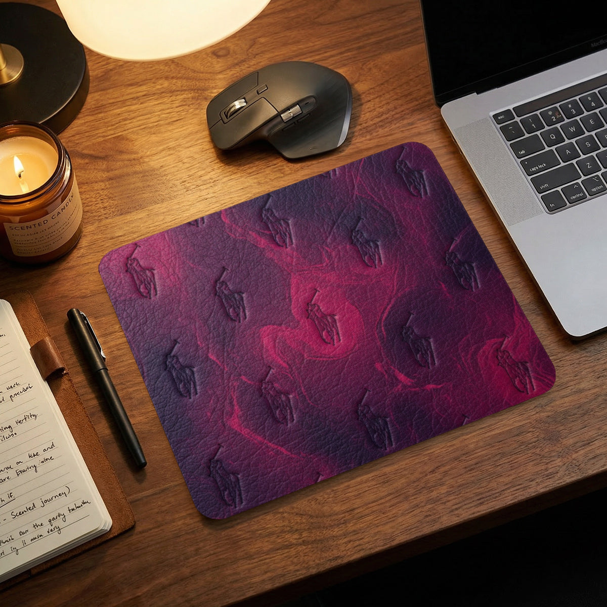 Embossed polo player pattern on a dark pink and purple mousepad.