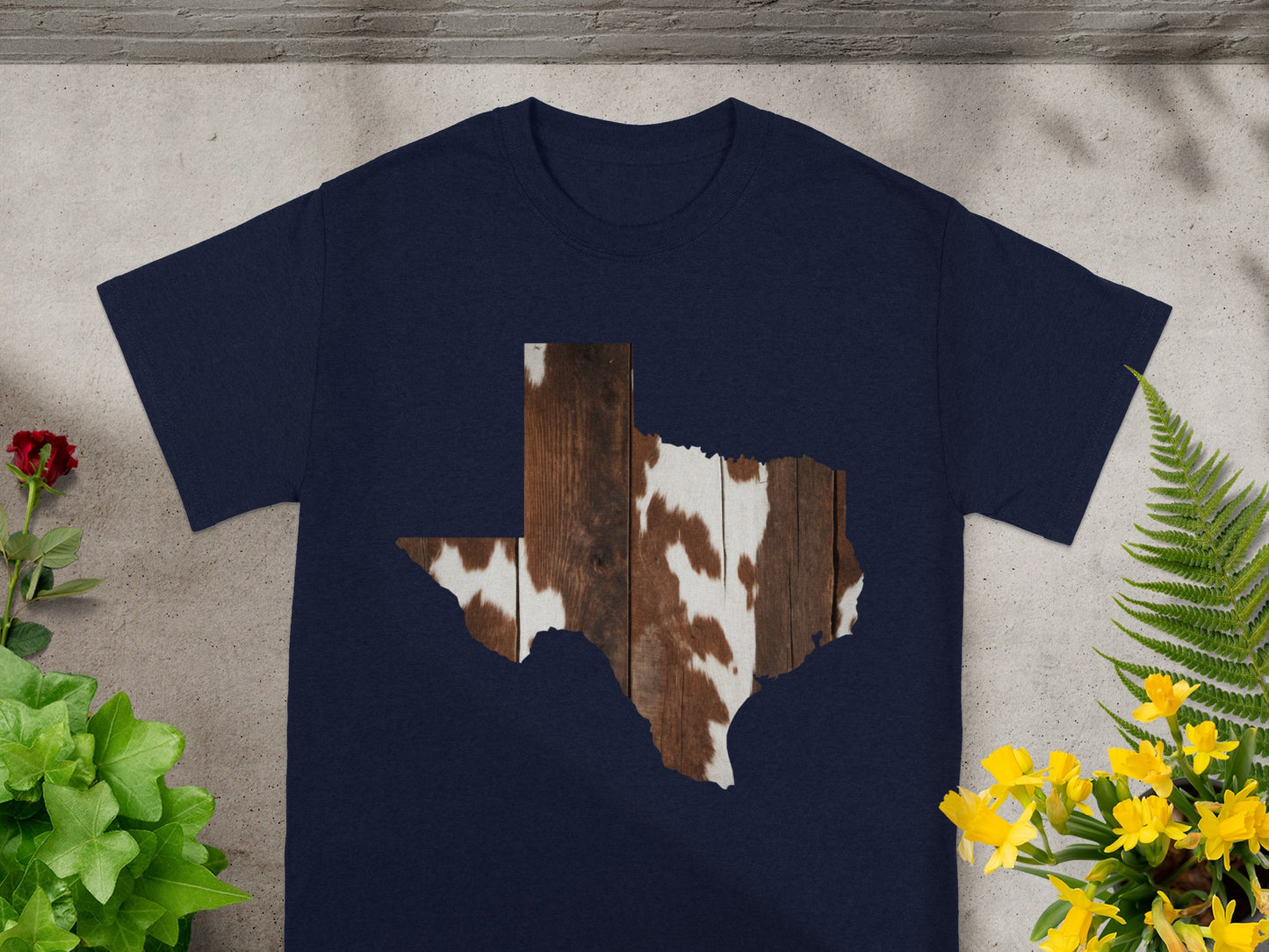 Navy t-shirt featuring a Texas outline filled with cowhide and wood plank texture.