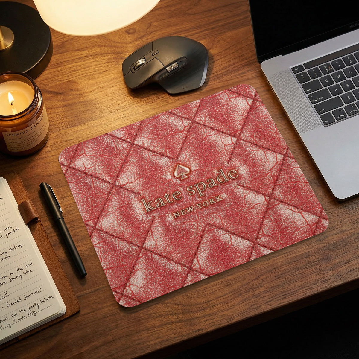 Red quilted mousepad with Kate Spade New York logo.