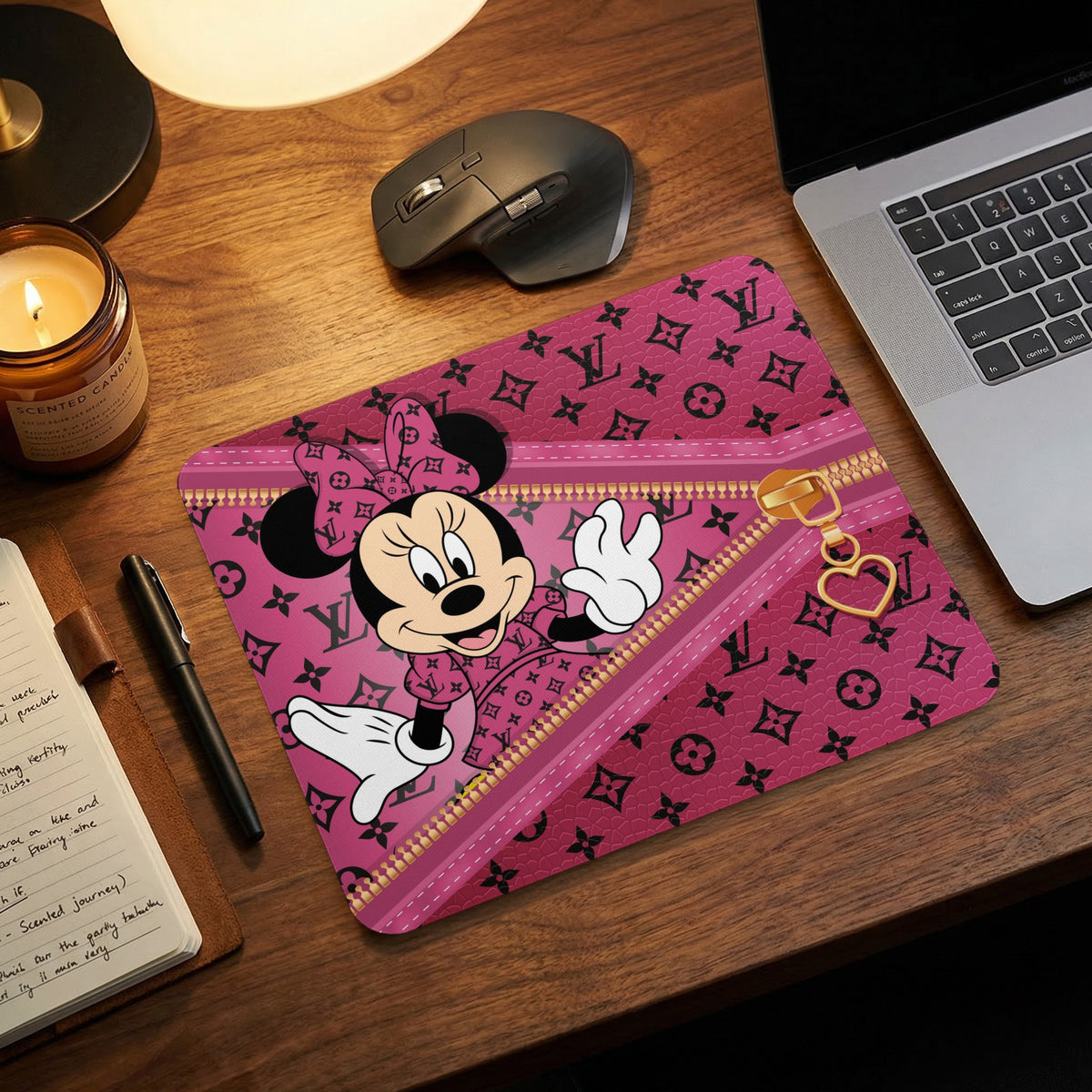 Pink mousepad featuring Minnie Mouse with a zipper and heart charm design.