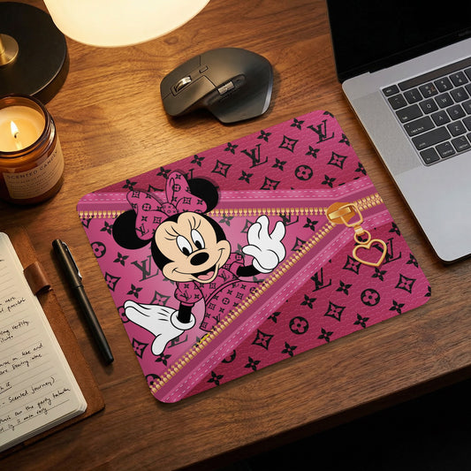 Pink mousepad featuring Minnie Mouse with a zipper and heart charm design.