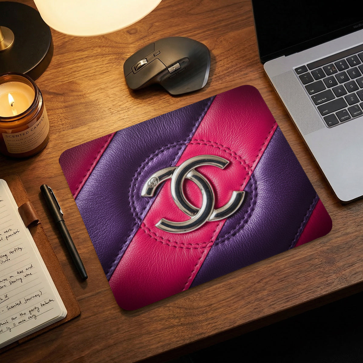 Mousepad with purple and pink quilted texture and silver interlocking C logo.