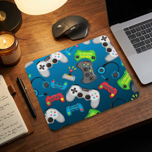 Blue mouse pad with a repeating pattern of gaming controllers, headphones, and text on a wooden desk.