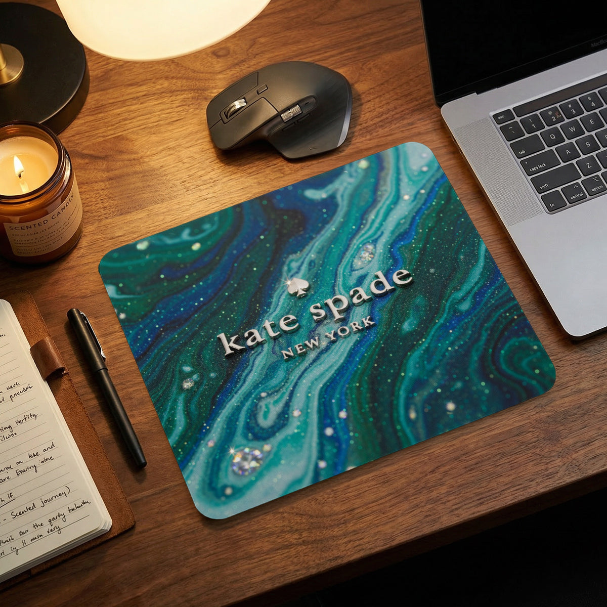 Kate Spade New York mousepad with green marble and glitter design.