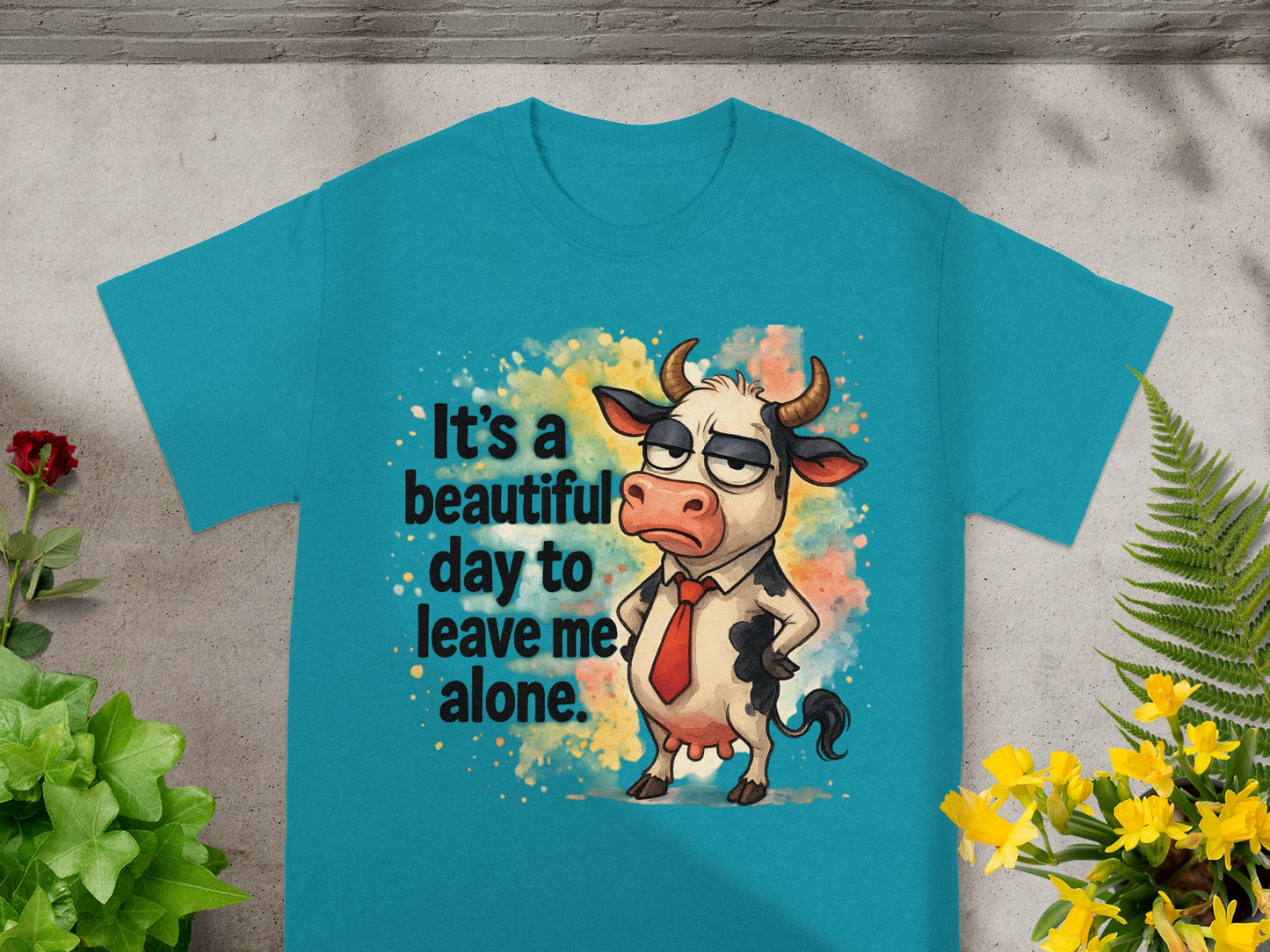 T-shirt with a cartoon cow that says "It's a beautiful day to leave me alone."