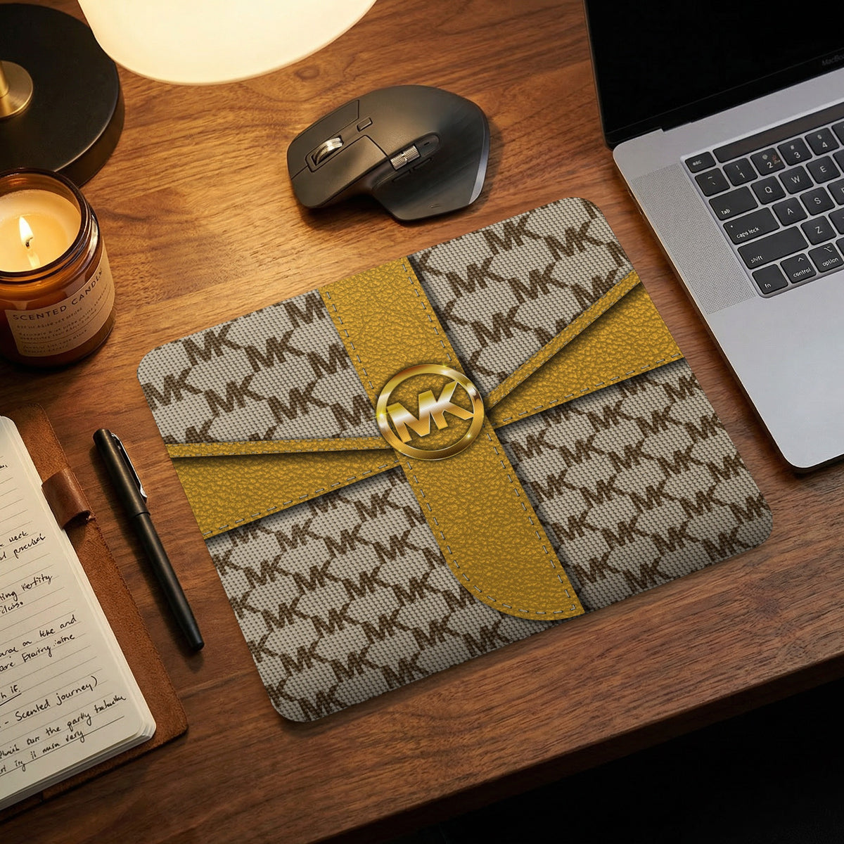MK patterned mousepad with gold ribbon accent and gold MK logo.