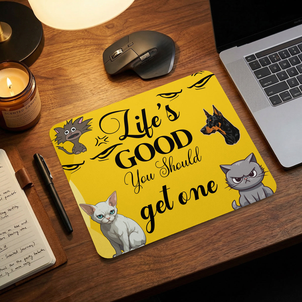 A yellow mousepad featuring cartoon dogs and cats, plus the text Life is Good You Should get one.