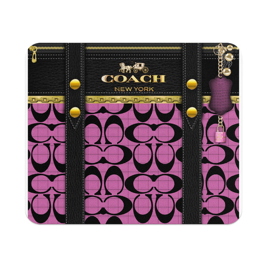 Coach New York logo on black leather with pink interlocking "C" pattern and charm.