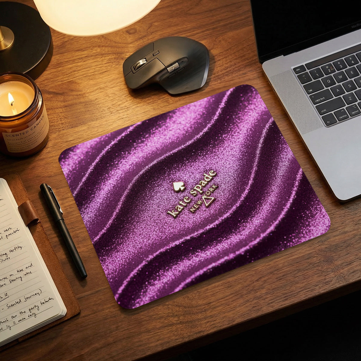 Kate Spade New York mousepad with a shimmering purple wavy design.