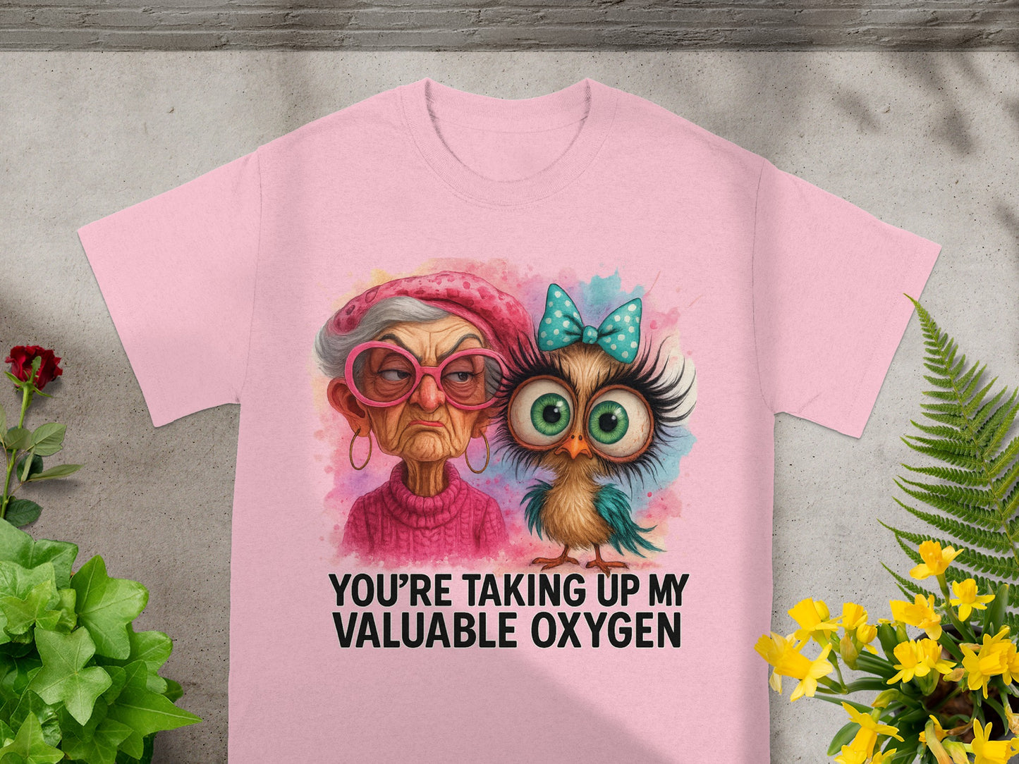Pink t-shirt with watercolor graphic of an elderly woman and an owl, text says "You're Taking Up My Valuable Oxygen."