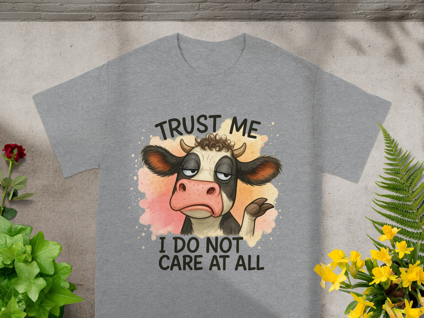 Grey t-shirt with cow illustration and text "Trust me I do not care at all".