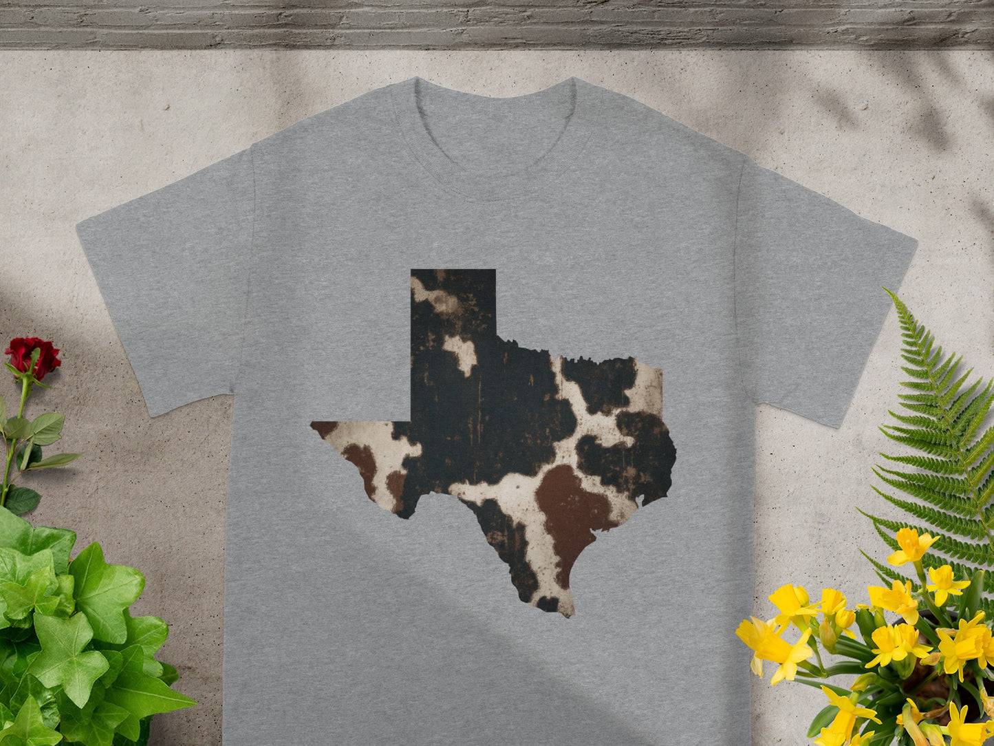 Gray t-shirt with a Texas map graphic in cowhide print.