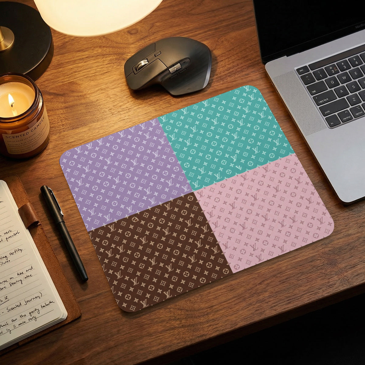Mousepad with four pastel quadrants, each featuring a repeating monogram pattern.