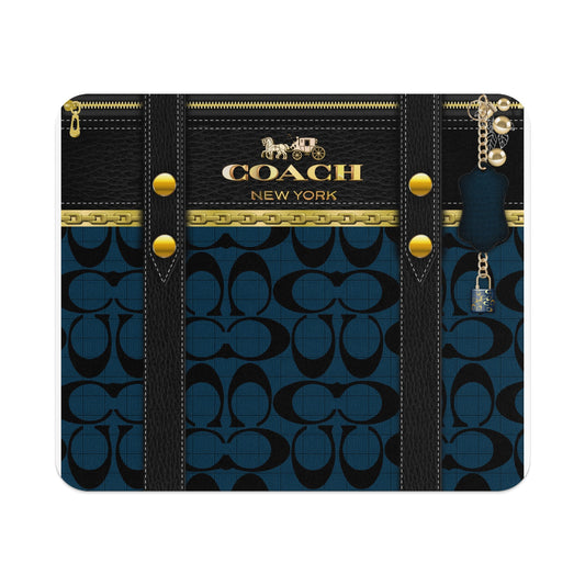 Coach New York logo on black and blue monogram with gold hardware and keychain.