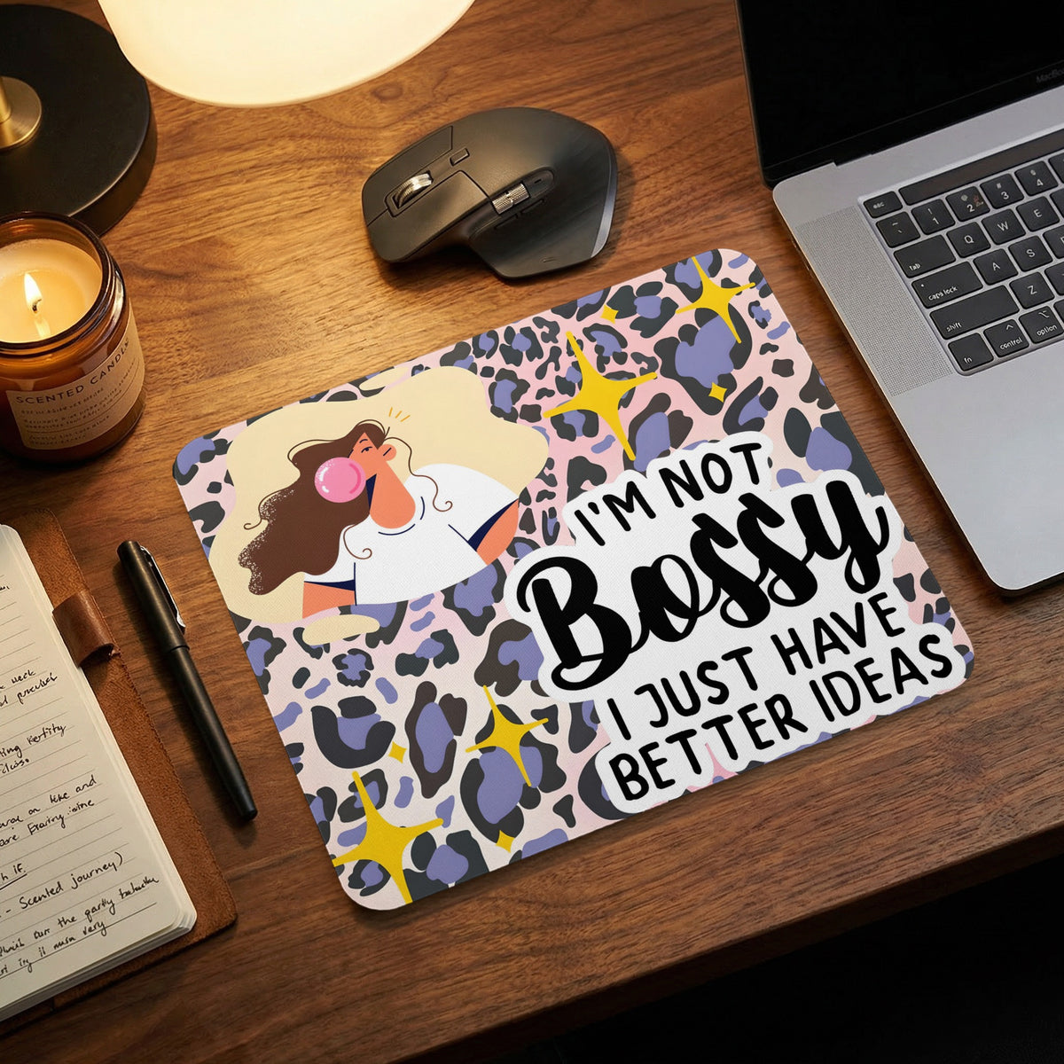 A pink, purple, and black leopard print mouse pad featuring the text, I'm not bossy, I just have better ideas.
