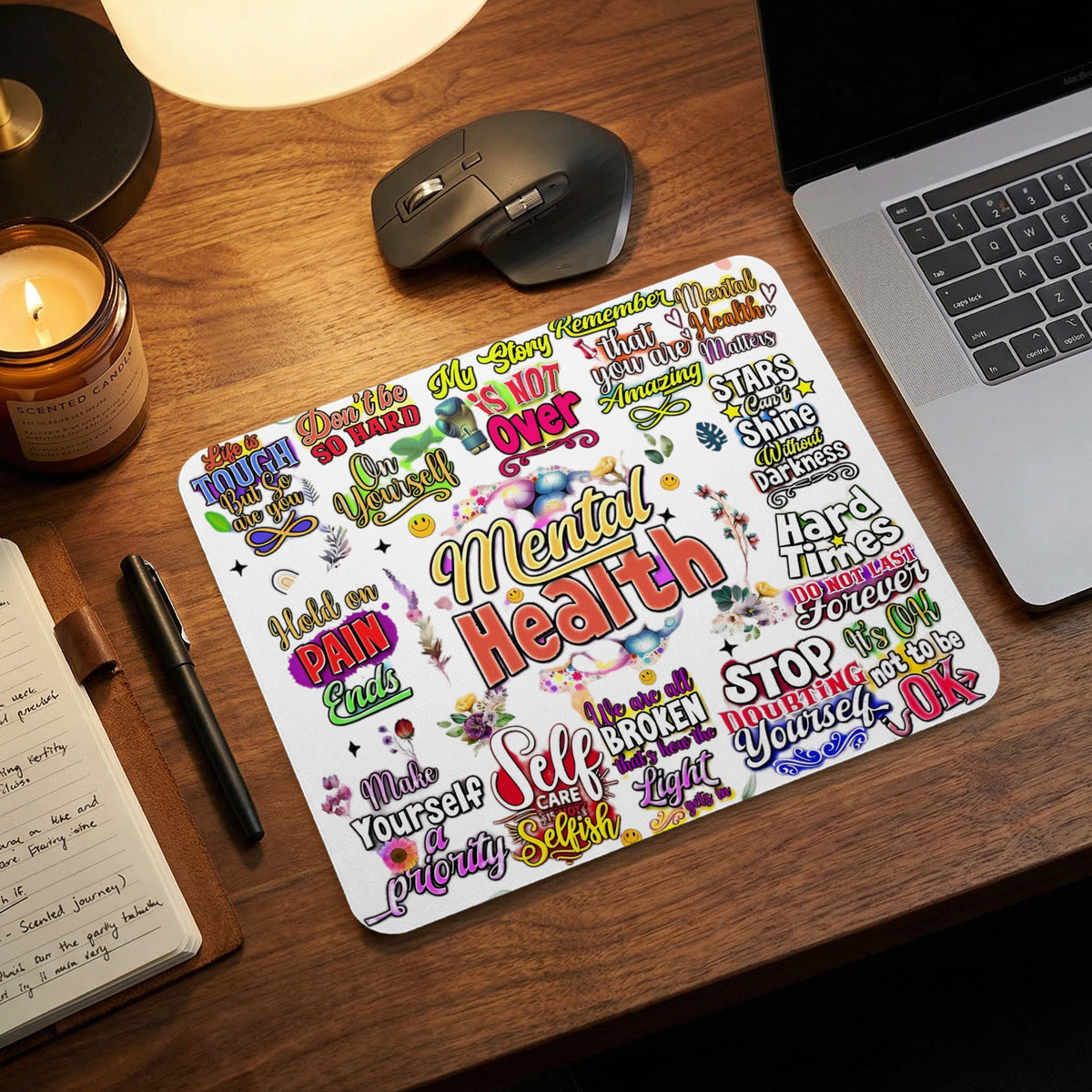 Mousepad with colorful text promoting mental health and self-care messages.