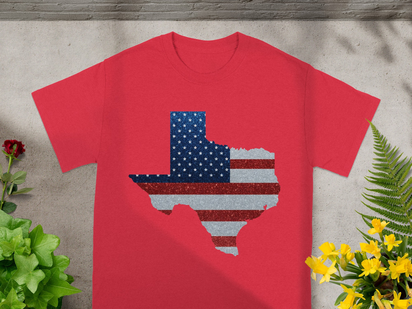 Red t-shirt with Texas map outline filled with American flag stripes and stars.