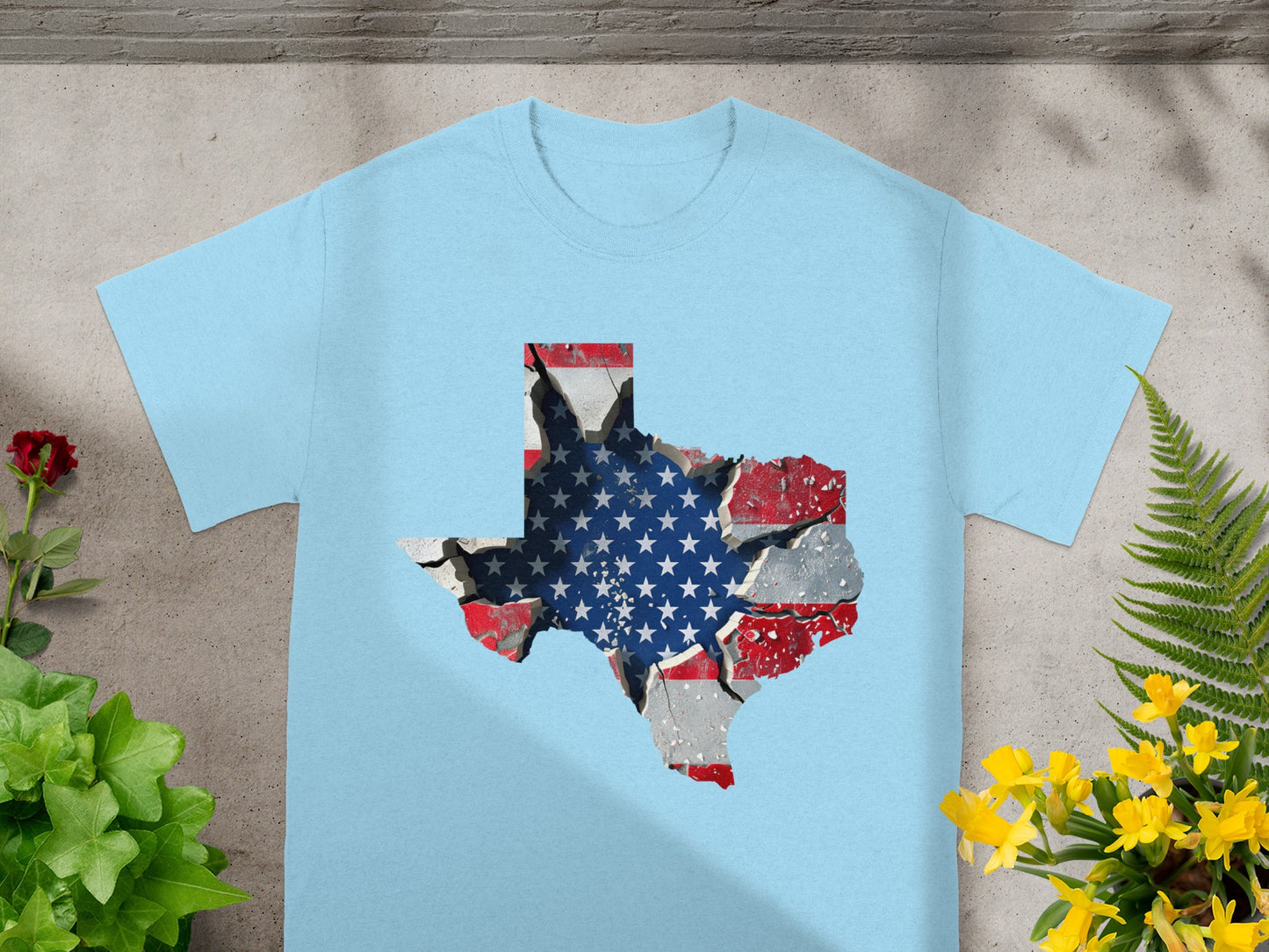 Light blue t-shirt with a cracked Texas-shaped graphic featuring the American flag.