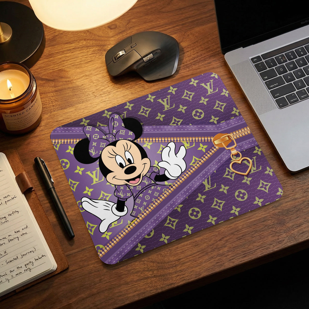 Minnie Mouse on a purple mousepad with a gold zipper and heart charm.