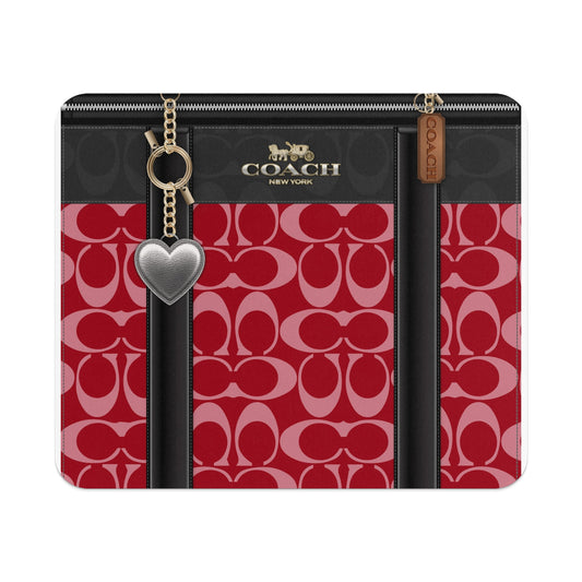 Coach C pattern red and black wallet with silver heart charm.