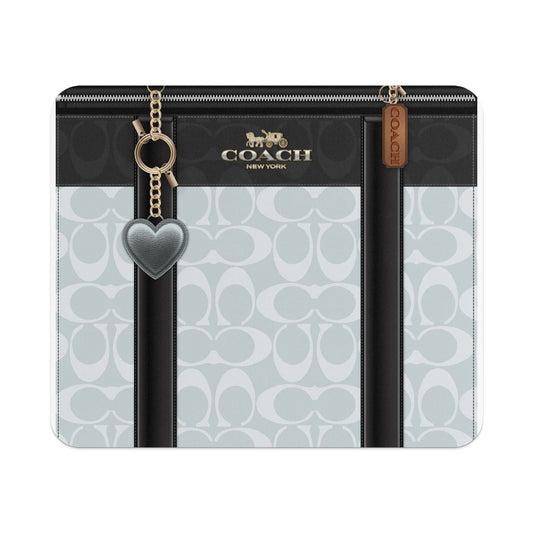 Coach logo print wallet with heart charm and leather tag.
