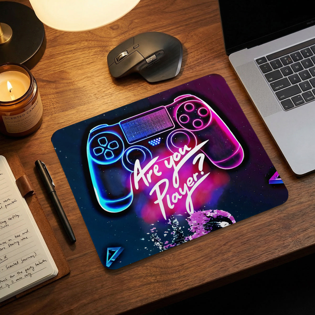 A rectangular mousepad featuring a glowing neon game controller graphic and the text Are you player? on a wooden desk.